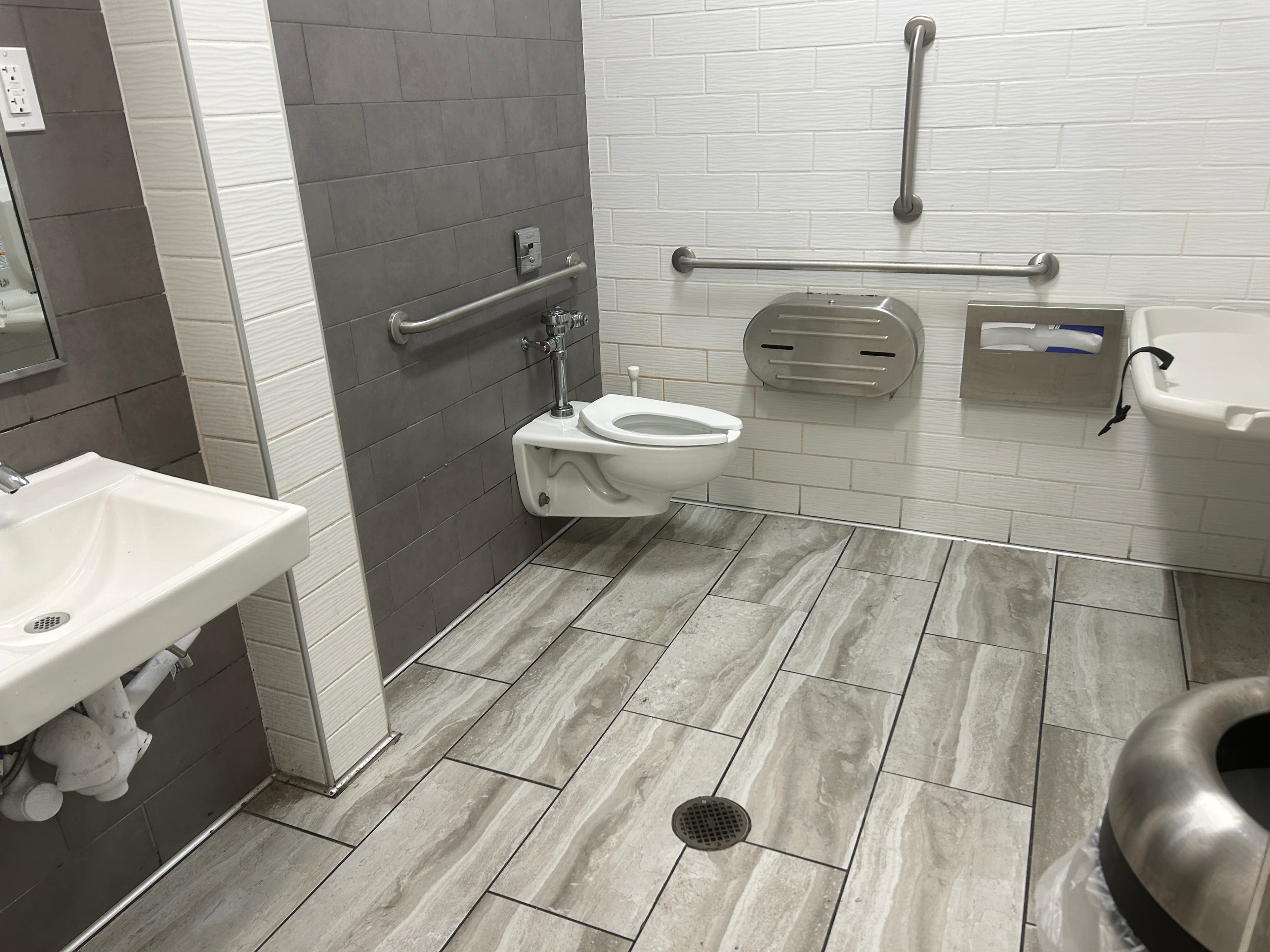 Commercial office restroom cleaned and sanitized by Bay Facility Management in Northern Alabama